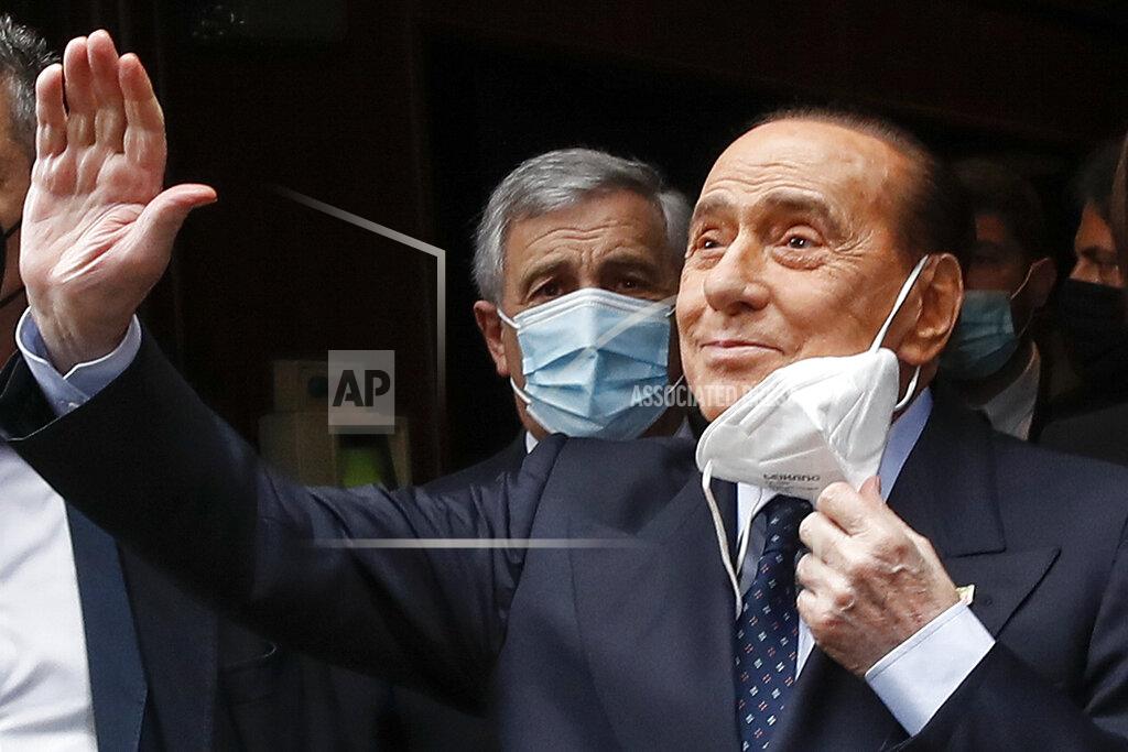 Alessandra Tarantino Former Italian Premier Silvio Berlusconi waves to reporters as he arrives at the Chamber of Deputies to meet Mario Draghi, in Rome, Tuesday, Feb. 9, 2021. Former European Central Bank chief Draghi is consulting Italy's fractious parties after being tapped by President Sergio Mattarella to try to pull together a government to guide the debt-riddled country through the health and economic crises it is confronting. (AP Photo/Alessandra Tarantino)