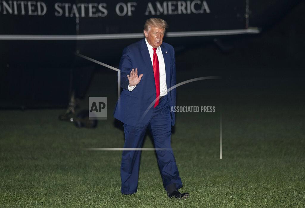 Alex Brandon President Donald Trump waves while walking from Marine One on the South Lawn of the White House, Friday, July 31, 2020, in Washington. Trump is returning from Florida. (AP Photo/Alex Brandon)