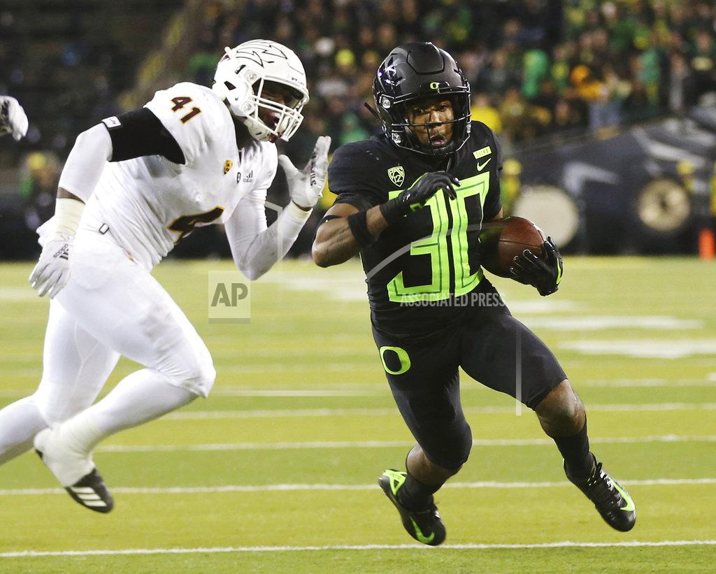 Chris Pietsch Oregon's Jaylon Redd, right, outruns Arizona State's Tyler Johnson on his way to a second quarter touchdown in an NCAA college football game Saturday, Nov. 17, 2018, in Eugene, Ore. (AP Photo/Chris Pietsch)