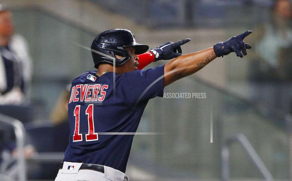 Noah K. Murray Boston Red Sox's Rafael Devers celebrates after scoring against the New York Yankees during the eighth inning of a baseball game Saturday, June 5, 2021, in New York. (AP Photo/Noah K. Murray)