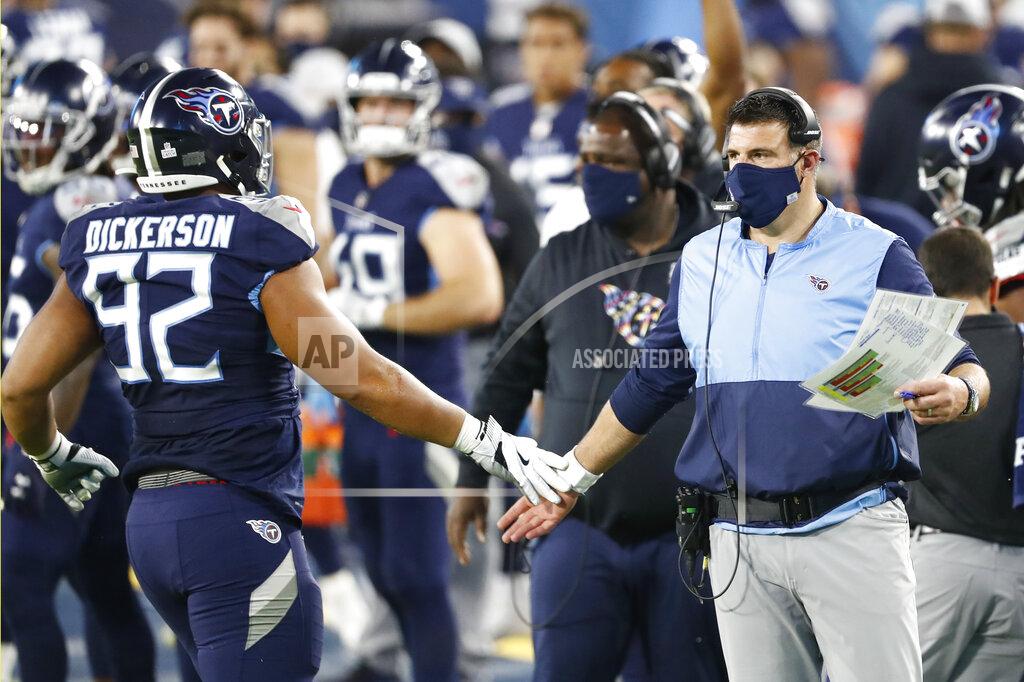 Wade Payne Tennessee Titans head coach Mike Vrabel slaps hands with defensive end Matt Dickerson (92) after a play against the Buffalo Bills in the first half of an NFL football game Tuesday, Oct. 13, 2020, in Nashville, Tenn. (AP Photo/Wade Payne)