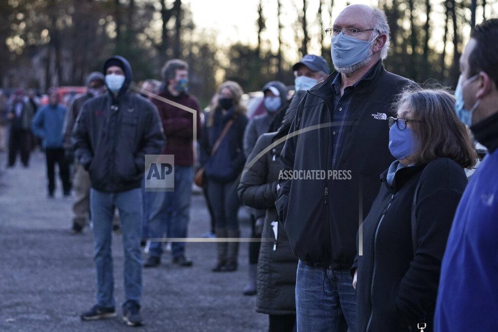 Tony Dejak People wait in line to vote at Adam Hall near Auburn Corners, Ohio, Tuesday, Nov. 3, 2020. (AP Photo/Tony Dejak)