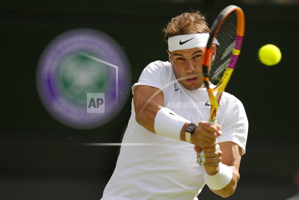 Kirsty Wigglesworth Spain's Rafael Nadal serves to Lithuania's Ricardas Berankis in a second round men's singles match on day four of the Wimbledon tennis championships in London, Thursday, June 30, 2022. (AP Photo/Kirsty Wigglesworth)