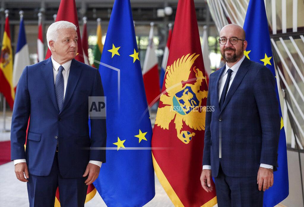 Stephanie Lecocq Montenegro's Prime Minister Dusko Markovic, left, and European Council President Charles Michel pose for the media before their meeting at the Europa building in Brussels, Monday, July 13, 2020. (Stephanie Lecocq, Pool Photo via AP)