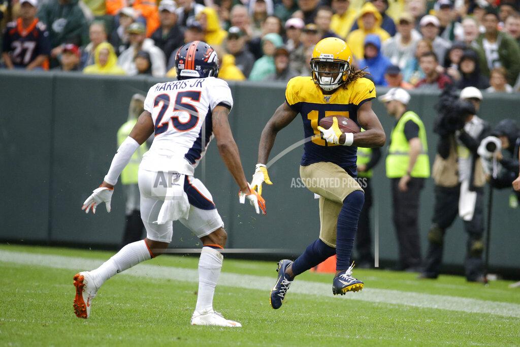 Mike Roemer Green Bay Packers wide receiver Davante Adams, right, runs with the ball after catching a pass as Denver Broncos cornerback Chris Harris (25) defends during the second half of an NFL football game Sunday, Sept. 22, 2019, in Green Bay, Wis. (AP Photo/Mike Roemer)