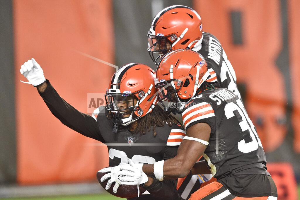 David Richard Cleveland Browns safety Sheldrick Redwine, left, celebrates with teammates after an interception during the second half of an NFL football game against the Indianapolis Colts, Sunday, Oct. 11, 2020, in Cleveland. The Browns won 32-23. (AP Photo/David Richard)