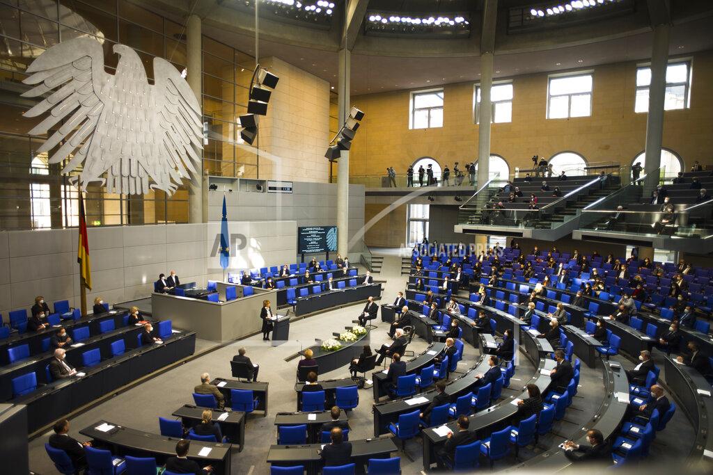Markus Schreiber Holocaust survivor Charlotte Knobloch, at the podium center, delivers a speech at the German Federal Parliament, Bundestag, in the Reichstag building in Berlin, Germany, Wednesday, Jan. 27, 2021 during a special meeting commemorating the victims of the Holocaust on the International Holocaust Remembrance Day. (AP Photo/Markus Schreiber)