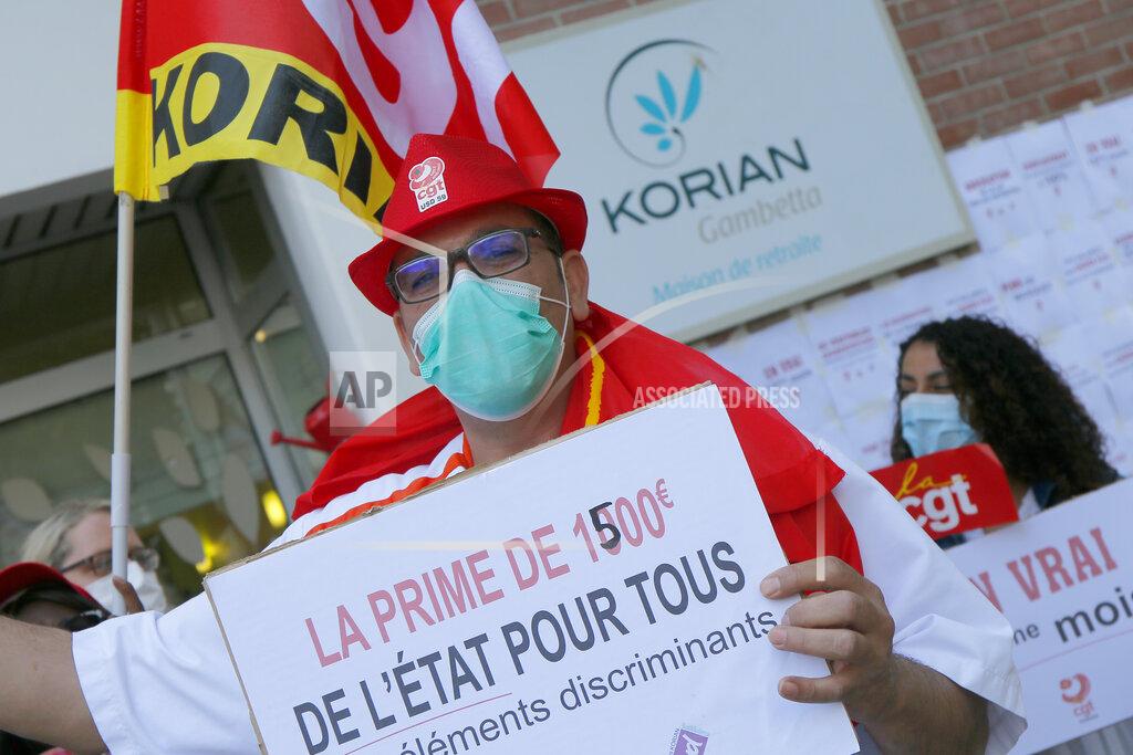 Michel Spingler Employees demonstrate to demand higher wages outside a nursing home of the Korian group, one of the market leaders in the lucrative industry of providing care and assisted living facilities for older adults, Monday, May 25, 2020 in Lille, northern France. In France, the group is facing several lawsuits filed by families who have lost loved ones during the coronavirus pandemic that has caused thousands of deaths in French care homes. (AP Photo/Michel Spingler)