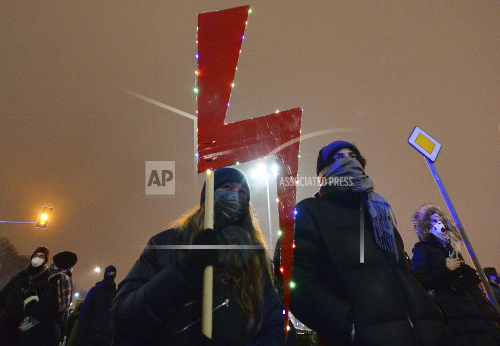 Czarek Sokolowski People march during a protest new a strict anti-abortion law in Warsaw, Poland, Thursday, Jan. 28, 2021. A near-total ban on abortion has taken effect in Poland three months after a top court ruled that the abortion of congenitally damaged fetuses is unconstitutional. Led by a women’s rights group, people poured onto the streets of Warsaw and other cities for the second evening in a row on Thursday to protest the move. (AP Photo/Czarek Sokolowski)