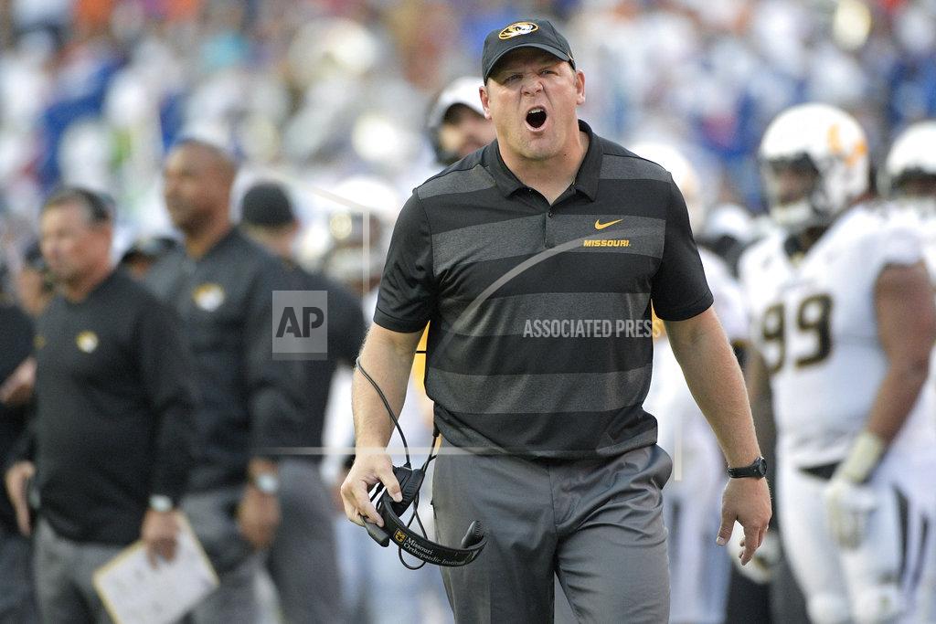 Phelan M. Ebenhack Missouri head coach Barry Odom calls to an official after a penalty during the second half of an NCAA college football game against Florida, Saturday, Nov. 3, 2018, in Gainesville, Fla. (AP Photo/Phelan M. Ebenhack)