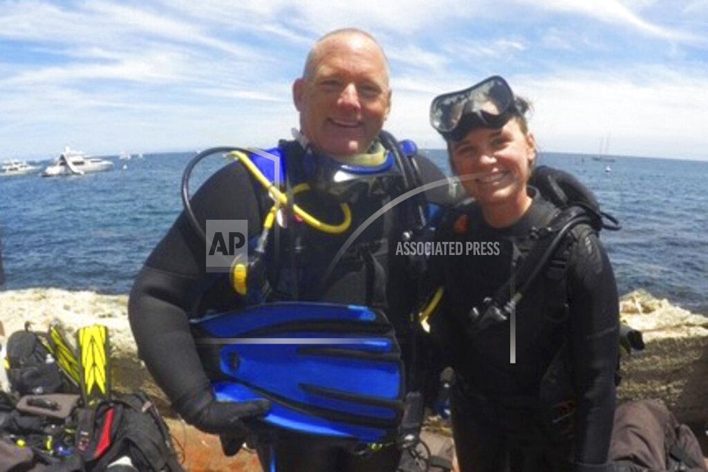 Christine Dignam In this 2018 photo, provided by Christine Dignam is her husband Justin Dignam, left, and their daughter Taylor at Santa Catalina Island, Calif. Justin Dignam was among 34 people who perished when fire swept through the Conception dive boat off the coast of Southern California on Sept. 2, 2019. (Christine Dignam via AP)