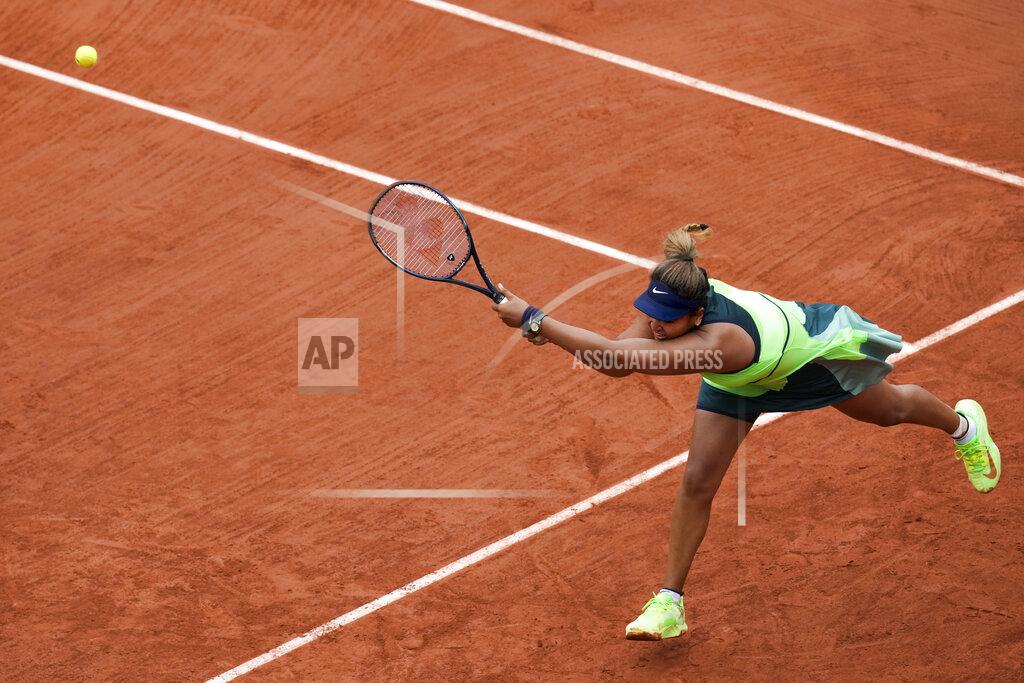 Christophe Ena Japan's Naomi Osaka plays a shot against Amanda Anisimova of the U.S. during their first round match at the French Open tennis tournament in Roland Garros stadium in Paris, France, Monday, May 23, 2022. (AP Photo/Christophe Ena)