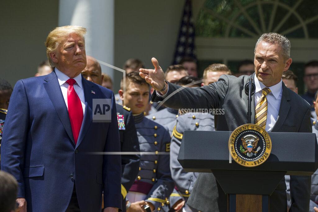 Alex Brandon President Donald Trump, watches as Army head football coach Jeff Monken speaks during the presentation of the Commander-in-Chief's Trophy to the U.S. Military Academy at West Point football team, in the Rose Garden of the White House, Monday, May 6, 2019, in Washington. (AP Photo/Alex Brandon)