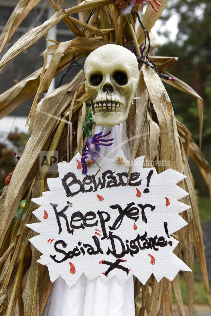 Michael Perez Halloween decorations are seen at the home of Carol McCarthy, reminding people to be safe while trick-or-treating during the COVID-19 pandemic, Monday, Oct. 26, 2020, in Palmyra, N.J. (AP Photo/Michael Perez)