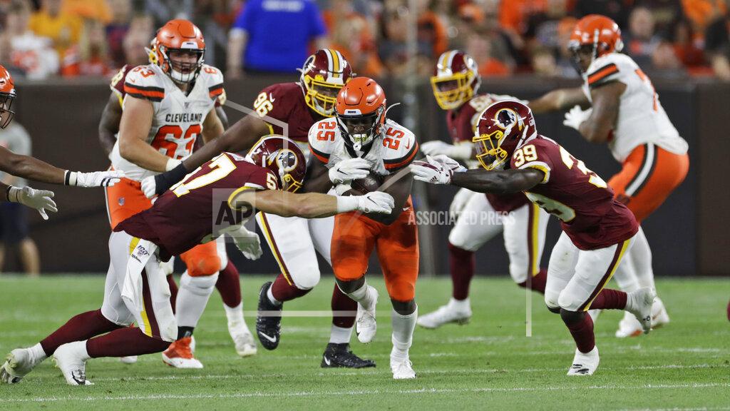 Ron Schwane Cleveland Browns running back Dontrell Hilliard (25) rushes during the first half of the team's NFL preseason football game against the Washington Redskins, Thursday, Aug. 8, 2019, in Cleveland. (AP Photo/Ron Schwane)