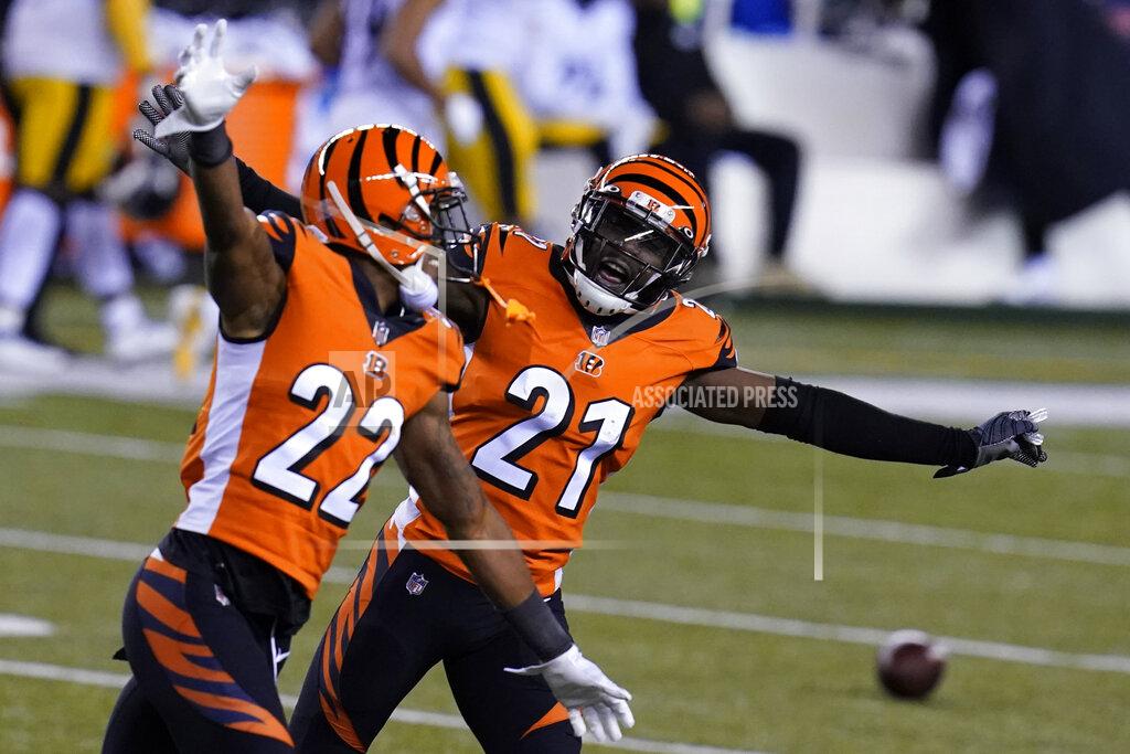 Michael Conroy Cincinnati Bengals' Mackensie Alexander (21) and William Jackson (22) celebrate after Pittsburgh Steelers turned the ball over on downs during the second half of an NFL football game, Monday, Dec. 21, 2020, in Cincinnati. (AP Photo/Michael Conroy)