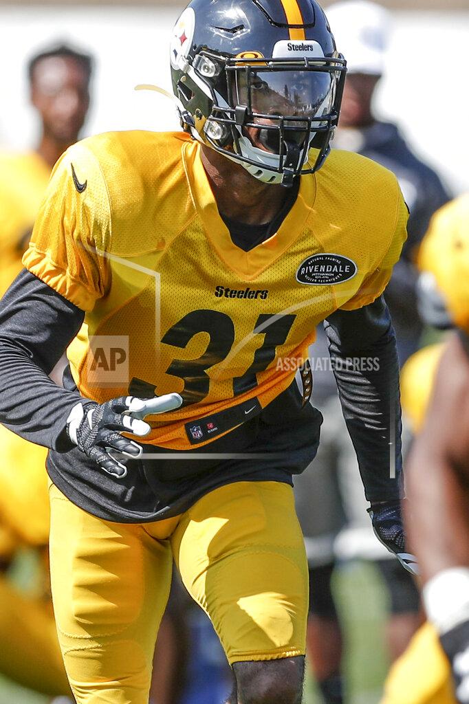 Keith Srakocic FILE - This Aug. 1, 2019, file photo shows Pittsburgh Steelers cornerback Justin Layne (31) as he drops into pass coverage during practice at their NFL football training camp in Latrobe, Pa. Layne began his college career as a wide receiver, not a cornerback while Zach Gentry figured he'd be an NFL quarterback, not a tight end. Sutton Smith is learning how to play linebacker and fullback. All three offer proof of Pittsburgh's emphasis in finding adaptable young players who can do a little bit of everything. (AP Photo/Keith Srakocic, File)