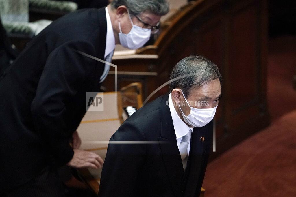 Japan's new Prime Minister Yoshihide Suga attends an extraordinary session at the upper house of parliament Thursday, Sept. 17, 2020, in Tokyo. Suga started his first full day in office Thursday, with a resolve to push for reforms for the people, and he said he is already taking a crack at it. (AP Photo/Eugene Hoshiko)