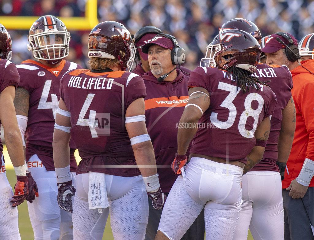 Matt Bell Virginia tech defensive coordinator Bud Foster, right, talks to his players during the first half of an NCAA college football game against Boston College in Blacksburg, Va., Saturday, Nov. 3, 2018. (AP Photo/Matt Bell)