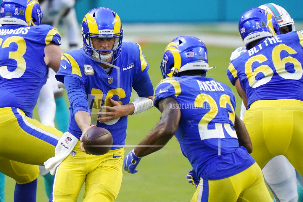 Wilfredo Lee Los Angeles Rams quarterback Jared Goff (16) hands the ball to running back Cam Akers (23), during the second half of an NFL football game against the Los Angeles Rams, Sunday, Nov. 1, 2020, in Miami Gardens, Fla. (AP Photo/Wilfredo Lee)