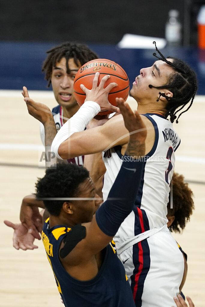 Darron Cummings Gonzaga's Andrew Nembhard (3) shoots against West Virginia's Gabe Osabuohien (3) during the second half of an NCAA college basketball game Wednesday, Dec. 2, 2020, in Indianapolis. (AP Photo/Darron Cummings)