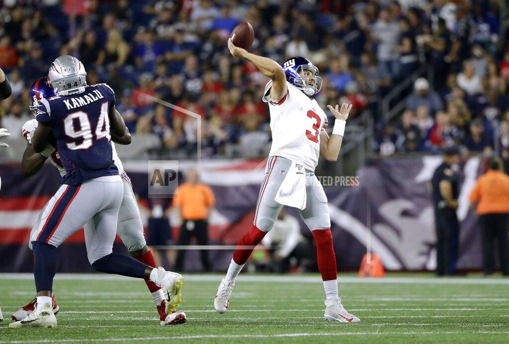Steven Senne New York Giants quarterback Alex Tanney passes under pressure from New England Patriots linebacker Ufomba Kamalu (94) in the first half of an NFL preseason football game, Thursday, Aug. 29, 2019, in Foxborough, Mass. (AP Photo/Steven Senne)