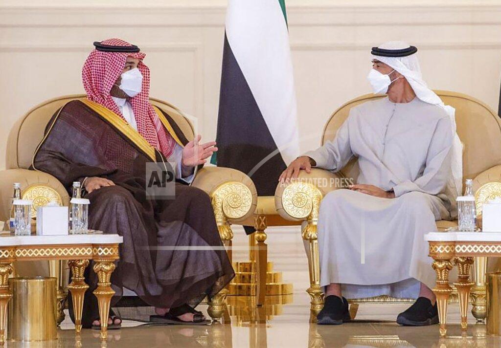 Uncredited In this photo released by Saudi Press Agency, Saudi Crown Prince Mohammed bin Salman, third left, offers condolences to Sheikh Mohamed bin Zayed Al Nahyan, president of the UAE and ruler of Abu Dhabi, third, right, on the passing of Sheikh Khalifa bin Zayed Al Nahyan, the late president of the UAE, at the Presidential Airport in Abu Dhabi, UAE, Monday, May 16, 2022. (Saudi Press Agency via AP)