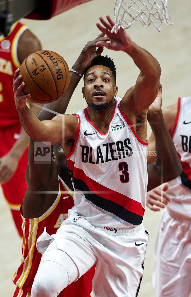 Craig Mitchelldyer Portland Trail Blazers guard CJ McCollum shoots against the Atlanta Hawks during the first half of an NBA basketball game in Portland, Ore., Saturday, Jan. 16, 2021. (AP Photo/Craig Mitchelldyer)