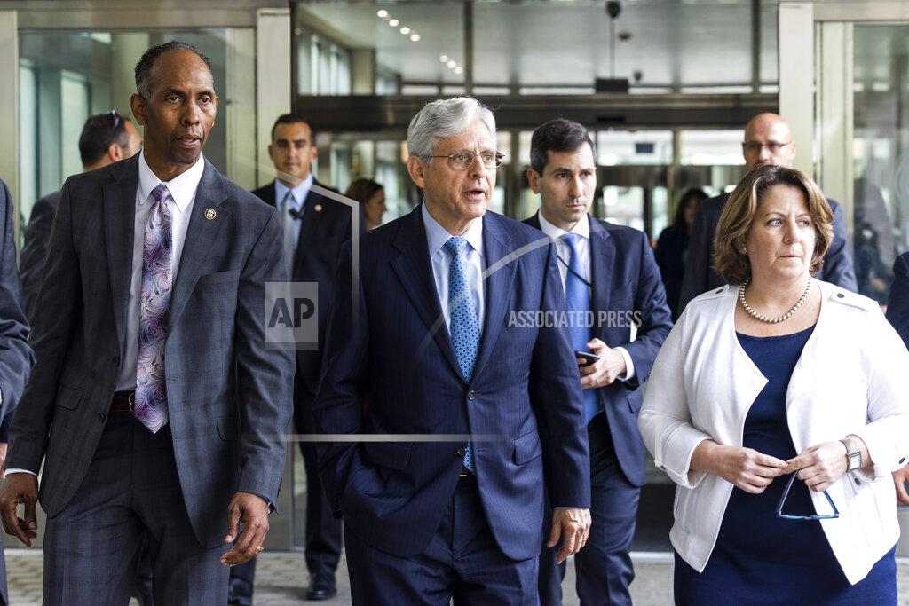 Jim Lo Scalzo Attorney General Merrick Garland, center, along with Deputy Attorney General Lisa Monaco, right, and Acting Alcohol, Tobacco and Firearms (ATF) Director Marvin G. Richardson, left, leaves the Bureau of Alcohol, Tobacco and Firearms headquarters in Washington, Thursday, July, 22 2021. (Jim Lo Scalzo/Pool via AP)