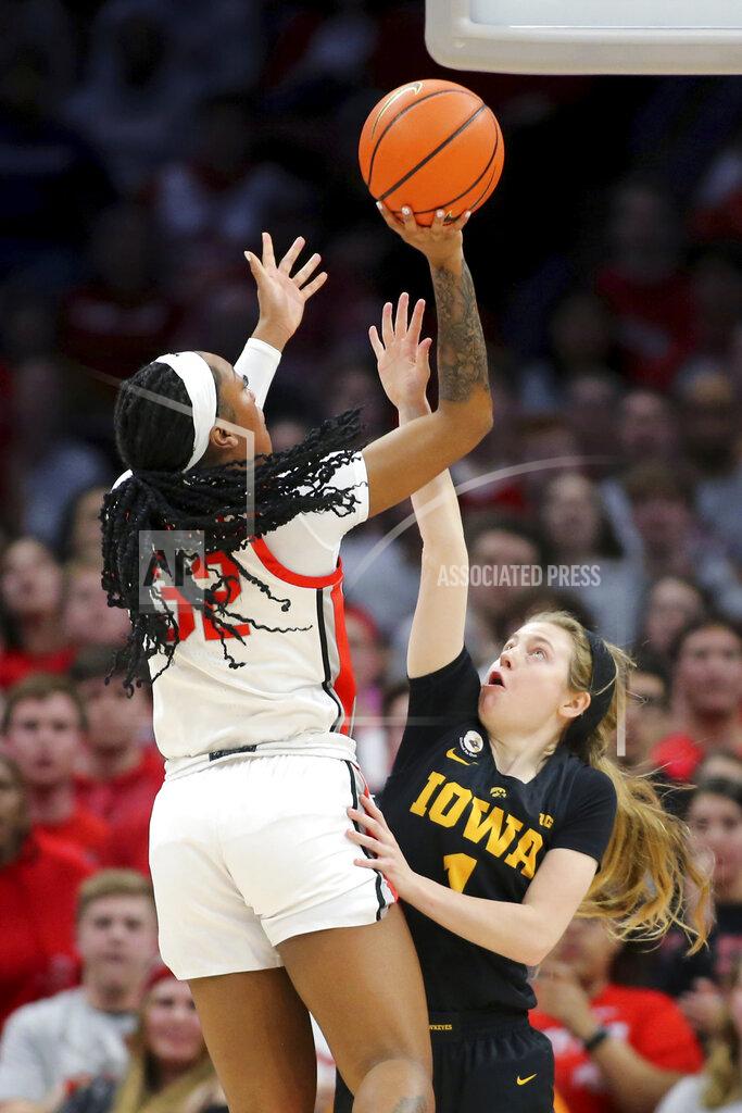 Joe Maiorana Ohio State forward Cotie McMahon, left, shoots over Iowa's Molly Davis during the second half of an NCAA college basketball game at Value City Arena in Columbus, Ohio, Monday, Jan. 23, 2023. (AP Photo/Joe Maiorana)