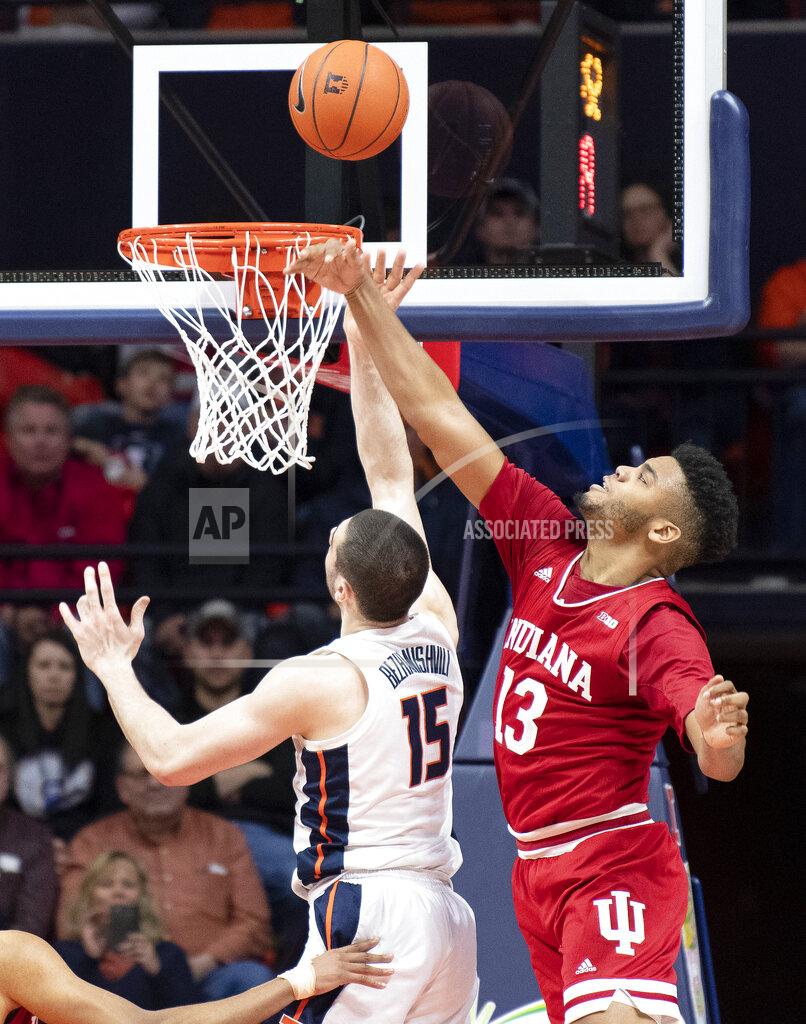Stephen Haas Indiana forward Juwan Morgan (13) defends against a shot from Illinois forward Giorgi Bezhanishvili (15) during the second half of an NCAA college basketball game in Champaign, Ill., Thursday, March 7, 2019. (AP Photo/Stephen Haas)