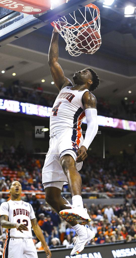 Julie Bennett Auburn player Malik Dunbar (4) dunks for two against North Florida during the second half of an NCAA college basketball game Saturday, Dec. 29, 2018, in Auburn, Ala. (AP Photo/Julie Bennett)