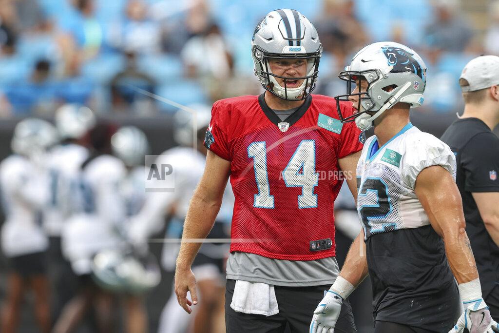 Nell Redmond Carolina Panthers quarterback Sam Darnold, left, talks to running back Christian McCaffrey during Fan Fest practice at the NFL football team's training camp in Charlotte, N.C., Friday, Aug. 6, 2021. (AP Photo/Nell Redmond)