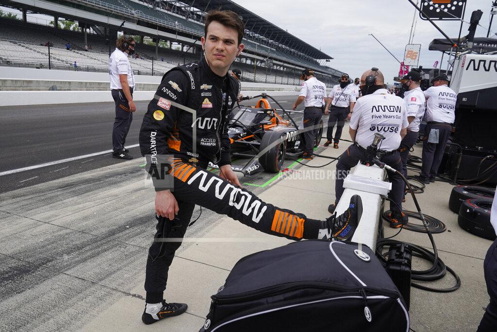 Darron Cummings Pato O'Ward, of Mexico, stretches during practice for the Indianapolis 500 auto race at Indianapolis Motor Speedway, Wednesday, May 19, 2021, in Indianapolis. (AP Photo/Darron Cummings)
