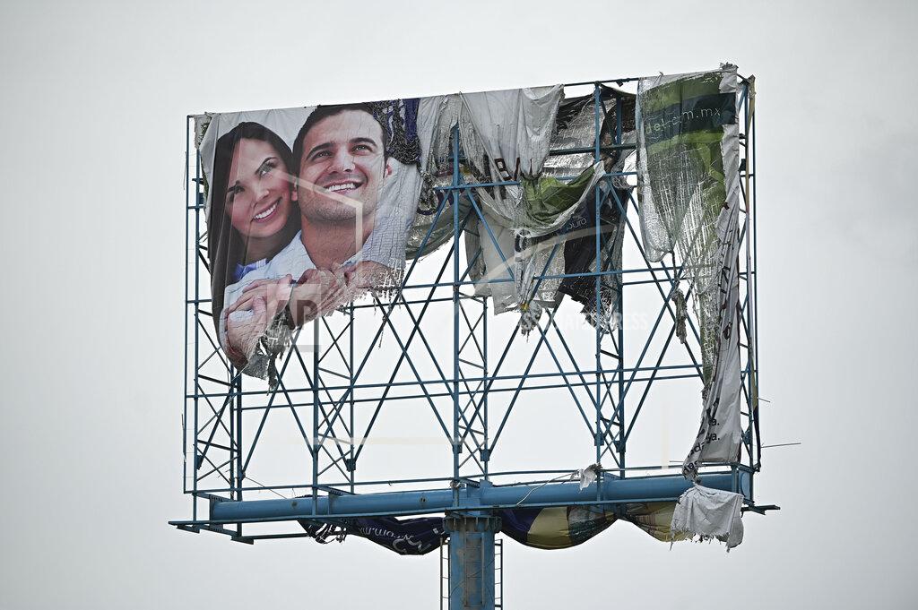 Roberto Echeagaray A billboard is damaged after the passing of Hurricane Pamela in Mazatlan, Mexico, Wednesday, Oct. 13, 2021. Pamela made landfall on Mexico's Pacific coast just north of Mazatlan on Wednesday, bringing high winds and rain to the port city. (AP Photo/Roberto Echeagaray)
