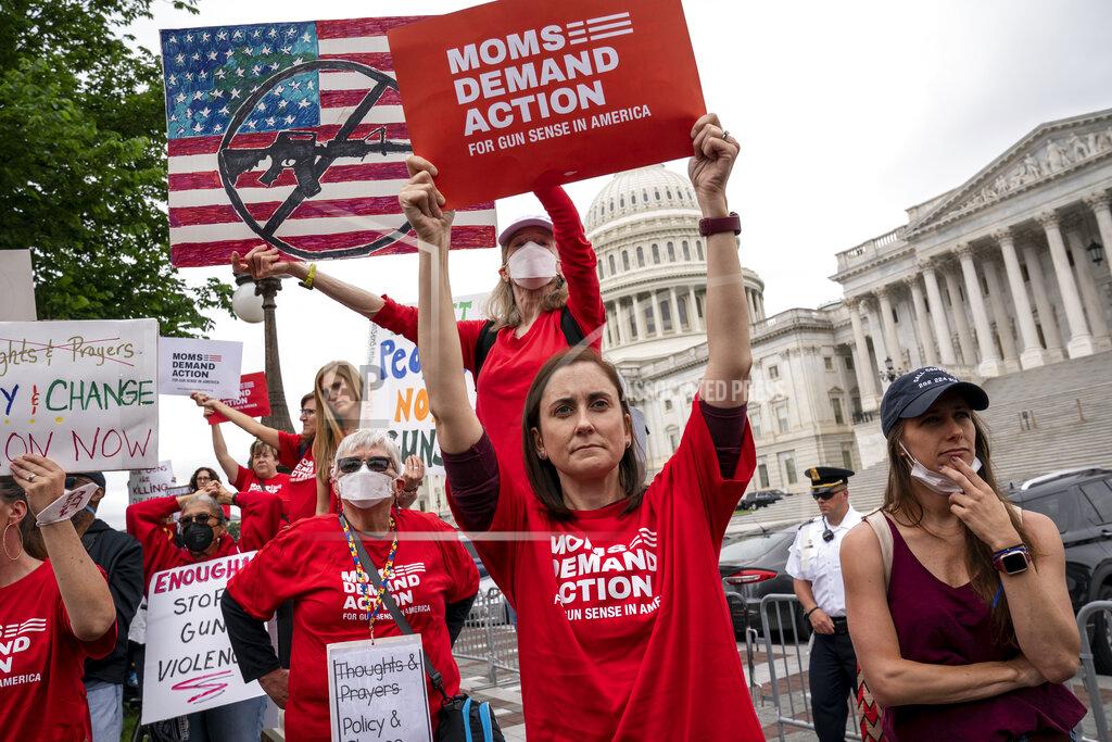 J. Scott Applewhite Activists join Senate Democrats outside the Capitol to demand action on gun control legislation after a gunman killed 19 children and two teachers in a Texas elementary school this week, in Washington, Thursday, May 26, 2022. A bipartisan group of senators is considering how Congress should respond to the horrific shooting of 19 children and two teachers in Uvalde, Texas. (AP Photo/J. Scott Applewhite)