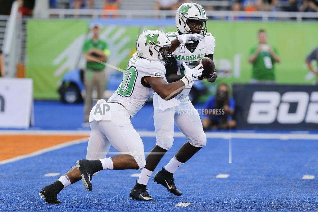 Otto Kitsinger Marshall quarterback Isaiah Green, right, hands off the ball to running back Brenden Knox, left, during the first half of an NCAA college football game against Boise State in Boise, Idaho, Friday, Sept. 6, 2019. (AP Photo/Otto Kitsinger)