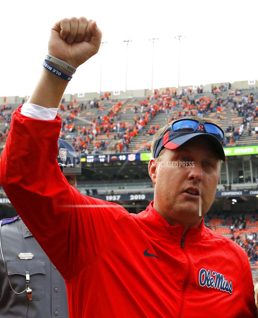 Butch Dill FILE - In this Oct. 31, 2015, file photo, Mississippi head coach Hugh Freeze celebrates after defeating Auburn 27-19 after an NCAA college football game, in Auburn, Ala. Liberty has hired former Mississippi coach Hugh Freeze to lead its football program. A person familiar with the situation told The Associated Press that the Flames have tabbed Freeze as their next coach. The person spoke to the AP on the condition of anonymity because neither the school nor Freeze has publicly announced the decision. Liberty has scheduled a news conference to "name Liberty's next head football coach" for Friday afternoon, Dec. 7, 2018.(AP Photo/Butch Dill)