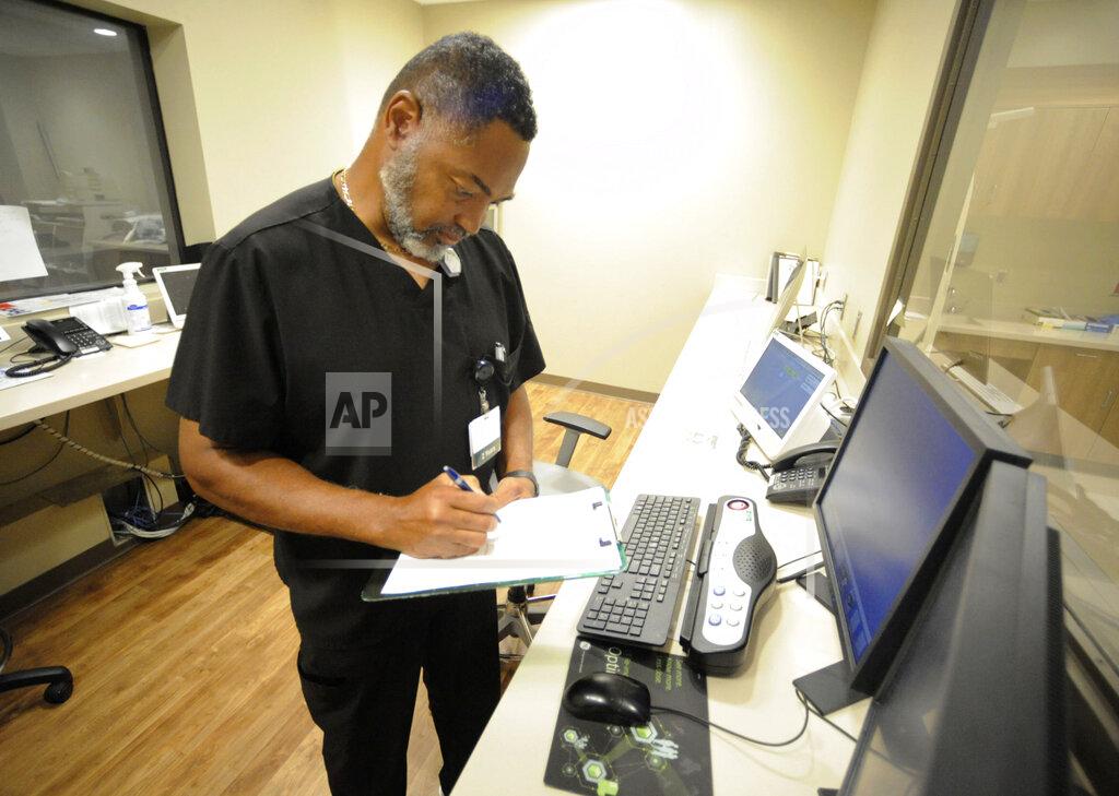 Jay Reeves Radiology manager Marshall C. Pritchett Jr. works on a file at Thomasville Regional Medical Center in Thomasville, Ala., on Tuesday, May 3, 2022. The hospital is among three in the nation that say they are missing out on federal pandemic relief money because they opened during or shortly before the COVID-19 crisis began. (AP Photo/Jay Reeves)