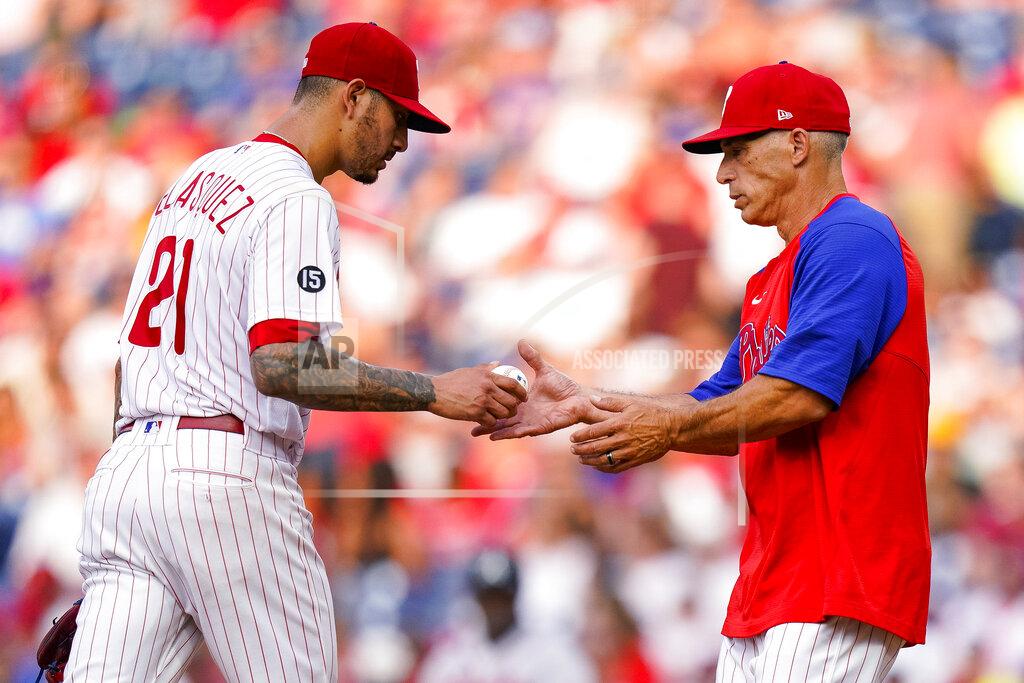 Chris Szagola Philadelphia Phillies manager Joe Girardi, right, takes the ball from starting pitcher Vince Velasquez during the third inning of the team's baseball game against the Atlanta Braves, Saturday, July 24, 2021, in Philadelphia. (AP Photo/Chris Szagola)