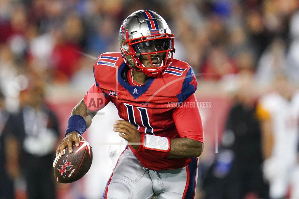 FILE - In this Feb. 8, 2020, file photo, Houston Roughnecks quarterback P.J. Walker (11) looks to pass as he scrambles during an XFL football game in Houston. A person familiar with the situation says the Panthers have agreed to terms on contracts with former XFL quarterback P.J. Walker of the Houston Roughnecks and former Raiders linebacker Tahir Whitehead. The person spoke to the Associated Press on condition of anonymity Monday, March 23, 2020, because the moves have not been announced by the team since the players have yet to pass physicals. (AP Photo/Matt Patterson, File)