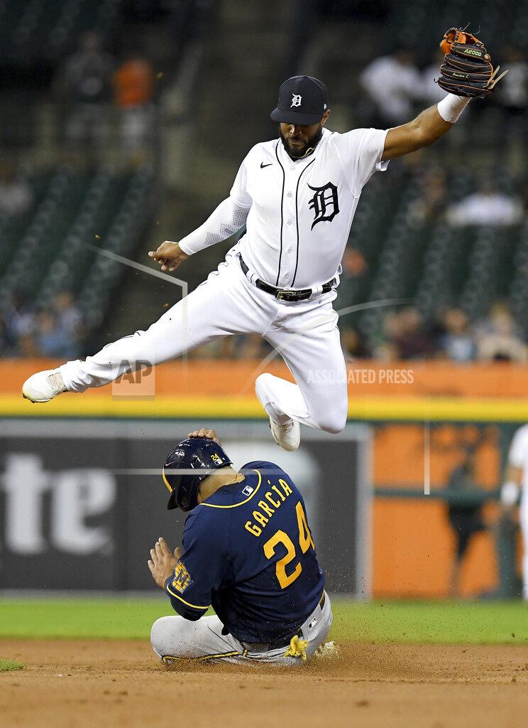 Lon Horwedel Milwaukee Brewers' Avisaíl García slides under Detroit Tigers shortstop Jeimer Candelario on a steal of second base during the fourth inning of a baseball game in Detroit, Tuesday, Sept. 14, 2021. (AP Photo/Lon Horwedel)
