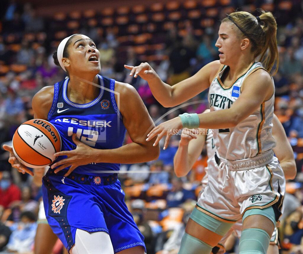 Sean D. Elliot Connecticut Sun center Brionna Jones (42) drives to the basket as New York Liberty guard Sabrina Ionescu defends during the first half of a WNBA basketball game Wednesday, Sept. 15, 2021, in Uncasville, Conn. (Sean D. Elliot/The Day via AP)