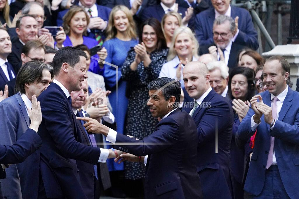 Alberto Pezzali FILE - Rishi Sunak, centre, gestures as conservative MPs greet him after arriving at the Conservative Party leadership contest at the Conservative party Headquarters in London, Oct. 24, 2022. In his first month as Britain's prime minister, Rishi Sunak has stabilized the economy, reassured allies from Washington to Kyiv and even soothed the European Union after years of sparring between Britain and the bloc. But Sunak’s challenges are just beginning. He is facing a stagnating economy, a cost-of-living crisis – and a Conservative Party that is fractious and increasingly unpopular after 12 years in power. (AP Photo/Alberto Pezzali, File)