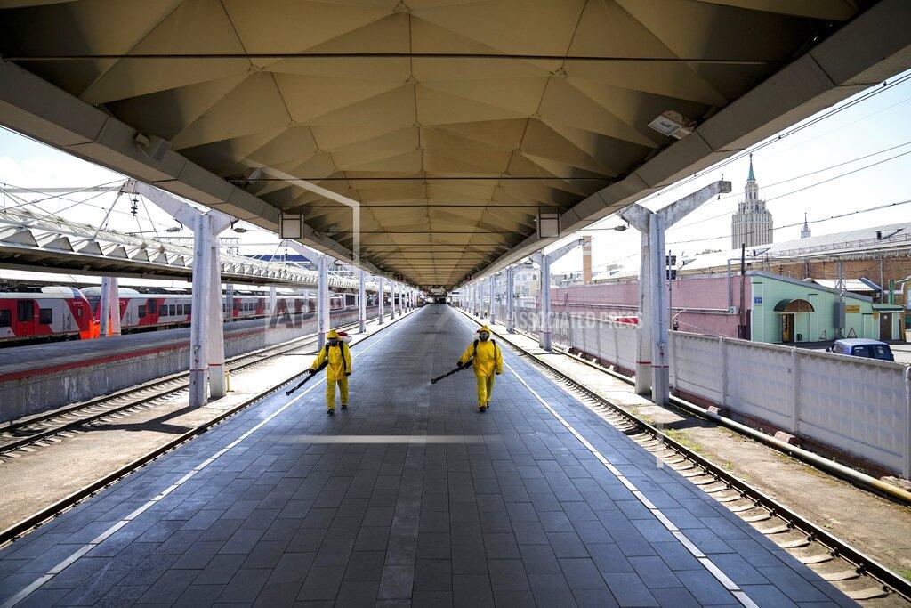 Alexander Zemlianichenko Employees of the Russian Emergency Situations disinfect a platform of Liningradsky railway station in Moscow in Moscow, Russia, Thursday, July 22, 2021. Russia has been facing a sharp increase in coronavirus infections in recent weeks, with the daily tally of confirmed cases going from about 9,000 in early June to over 25,000 in mid-July. On Thursday, the country's state coronavirus task force reported 24,471 new infections and 796 deaths. (AP Photo/Alexander Zemlianichenko)