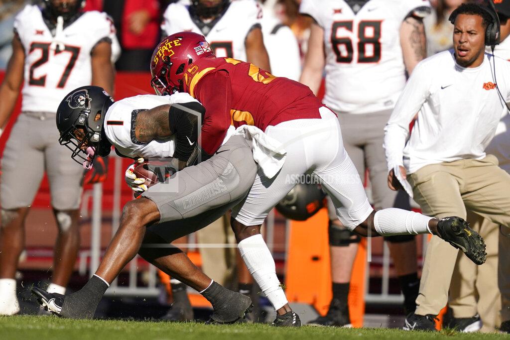 Charlie Neibergall Oklahoma State wide receiver Tay Martin (1) catches a pass in front of Iowa State defensive back T.J. Tampa during the first half of an NCAA college football game, Saturday, Oct. 23, 2021, in Ames, Iowa. (AP Photo/Charlie Neibergall)