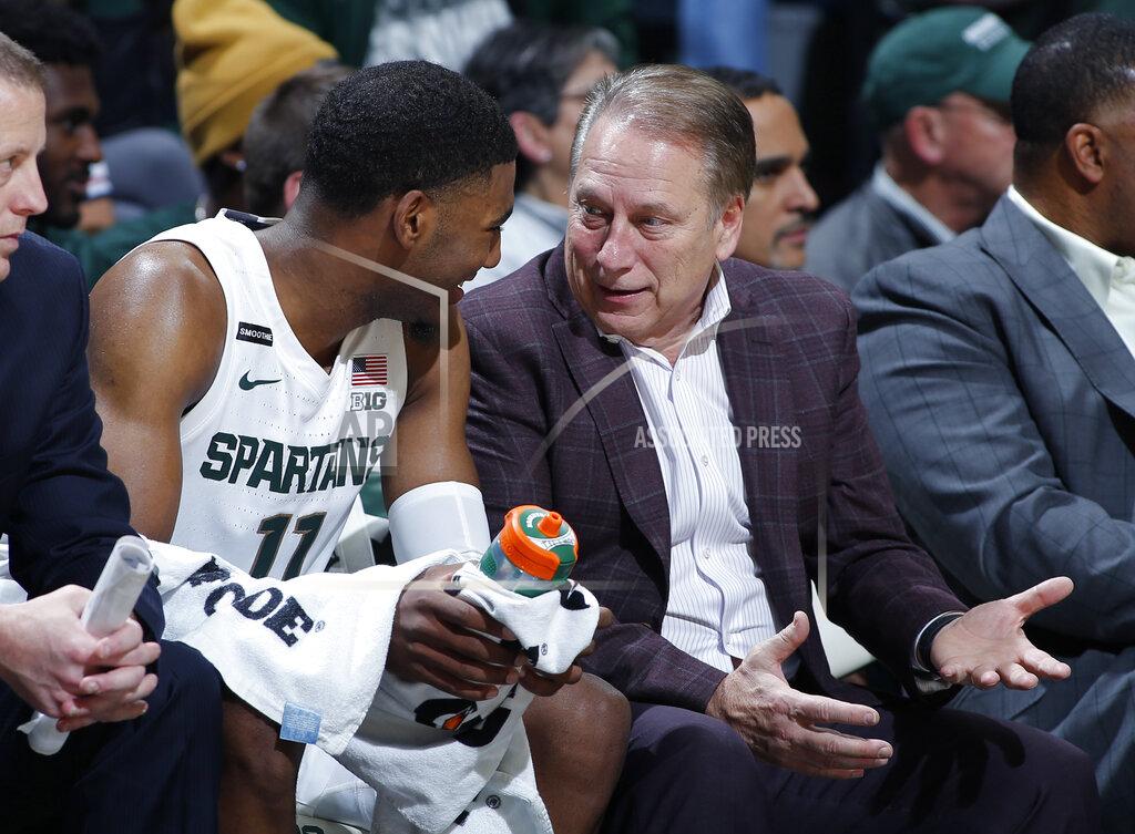 Al Goldis Michigan State coach Tom Izzo, right, talks with Aaron Henry on the bench during the second half of an NCAA college basketball game against Eastern Michigan, Saturday, Dec. 21, 2019, in East Lansing, Mich. (AP Photo/Al Goldis)
