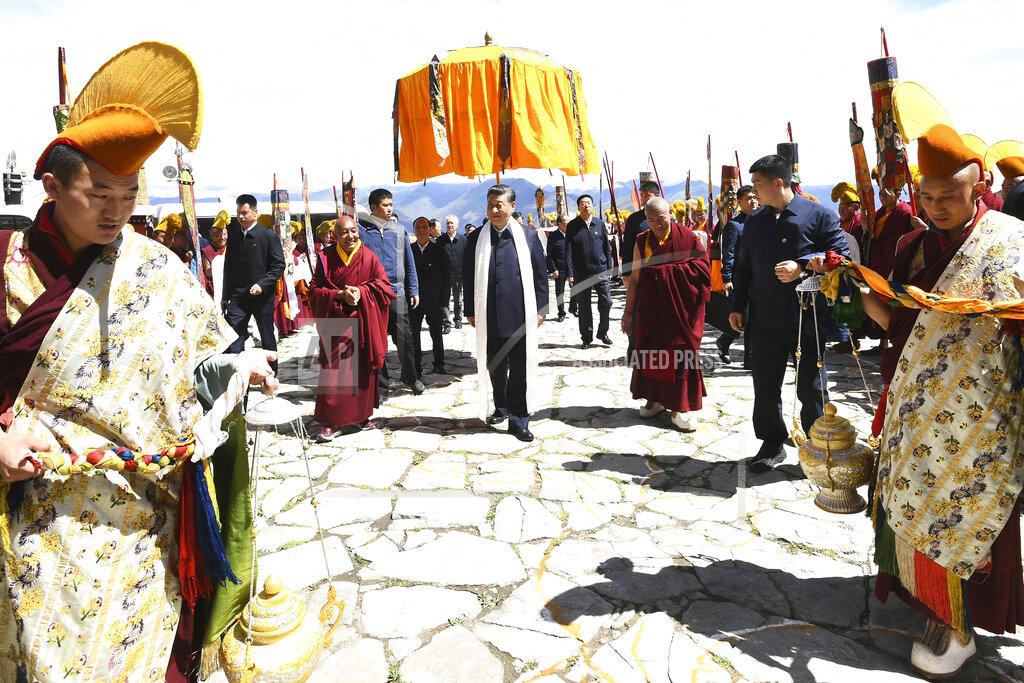 Xie Huanchi In this July 22, 2021, photo released by China's Xinhua News Agency, Chinese President Xi Jinping, center, visits the Drepung Monastery near Lhasa in western China's Tibet Autonomous Region. Chinese leader Xi Jinping has made a rare visit to Tibet as authorities tighten controls over the Himalayan region's traditional Buddhist culture, accompanied by an accelerated drive for economic development. (Xie Huanchi/Xinhua via AP)