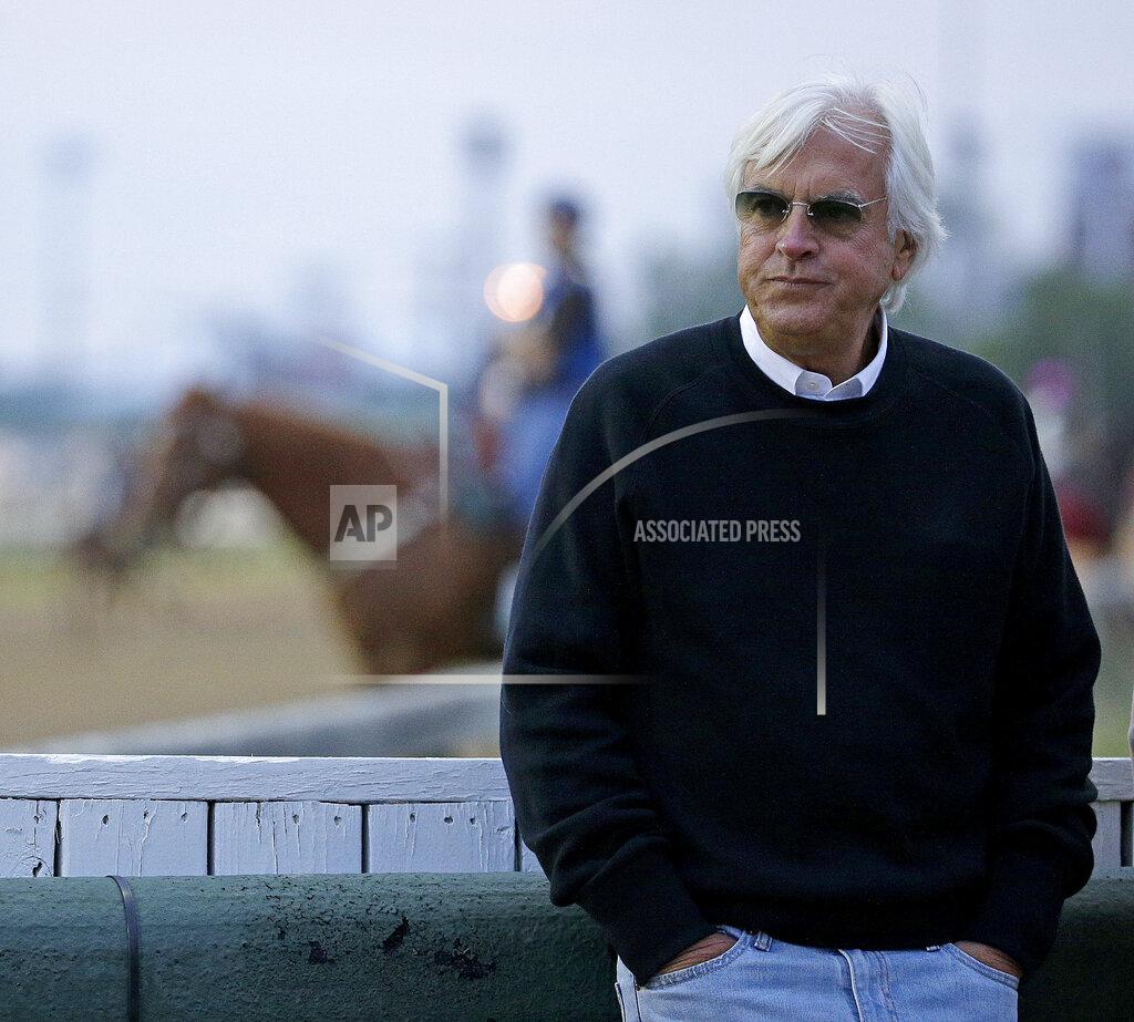 FILE - In this May 3, 2016, file photo, trainer Bob Baffert watches a workout at Churchill Downs in Louisville, Ky. The first Saturday in May is usually the first leg of horse racing's Triple Crown. But the Kentucky Derby won't be run in May for the first time since 1945, instead pushed back four months to Labor Day weekend. (AP Photo/Charlie Riedel, File)