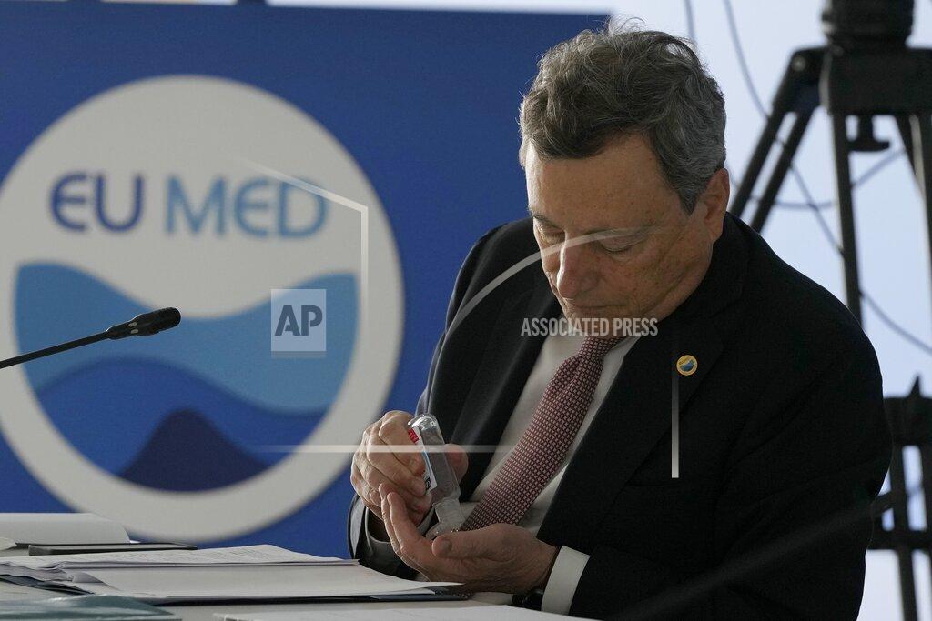 Thanassis Stavrakis Italian Prime Minister Mario Draghi attends the EUMED 9 summit at the Stavros Niarchos Foundation Cultural Center in Athens, Friday, Sept. 17, 2021. Nine European countries on the Mediterranean are holding a summit in Athens to discuss issues ranging from climate change and the pandemic response to migration and Afghanistan. (AP Photo/Thanassis Stavrakis)
